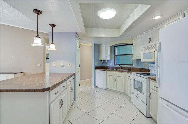 kitchen with light tile patterned floors, white cabinets, white appliances, and sink