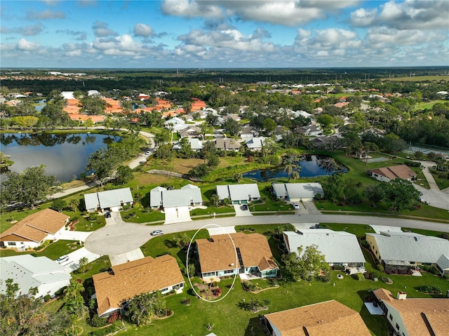 drone / aerial view with a water view