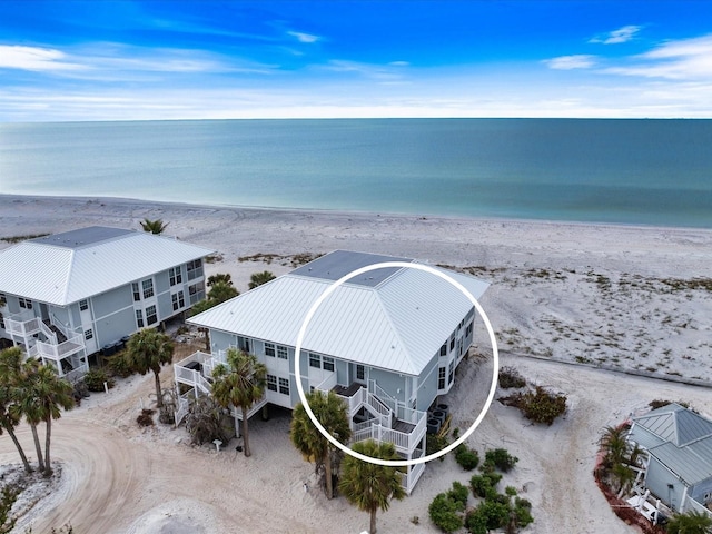 bird's eye view with a view of the beach and a water view