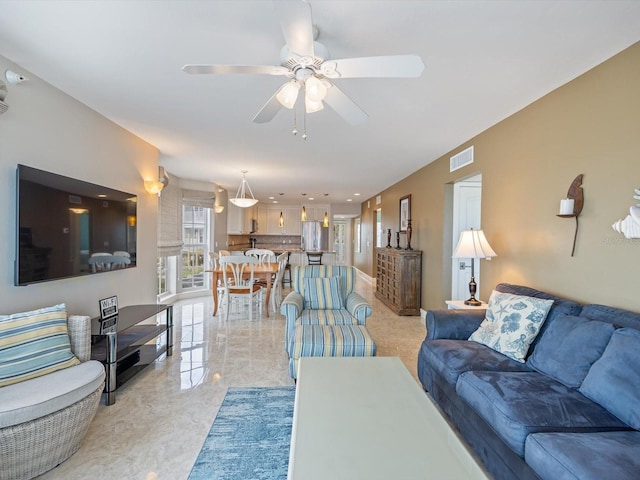 living room featuring ceiling fan