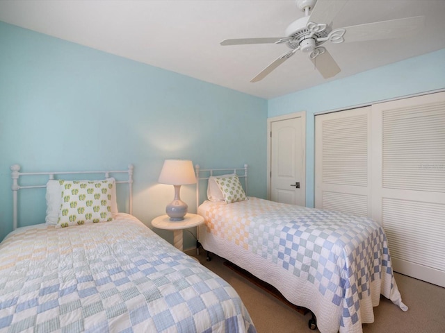 bedroom with carpet flooring, ceiling fan, and a closet