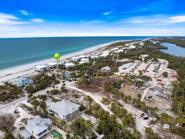 bird's eye view with a view of the beach and a water view