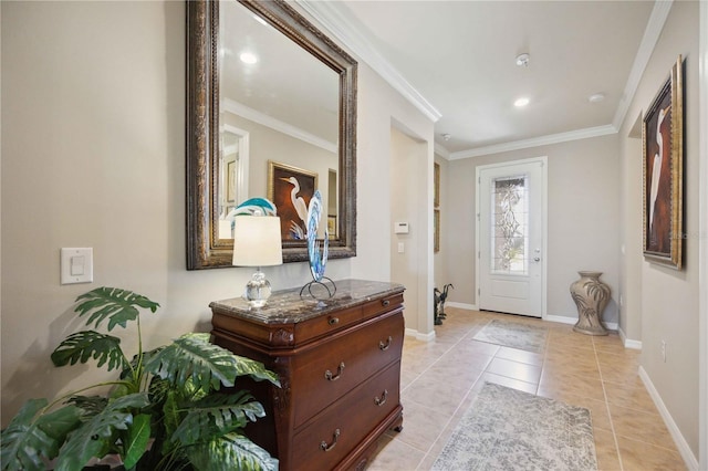 foyer featuring light tile patterned floors and crown molding