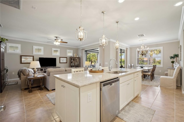 kitchen featuring sink, stainless steel dishwasher, ceiling fan, light stone countertops, and an island with sink