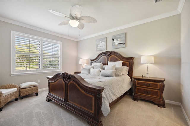 carpeted bedroom featuring ceiling fan and crown molding