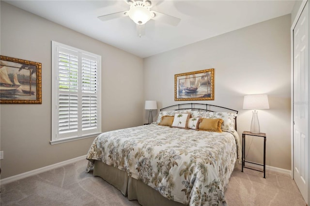 bedroom with light carpet, a closet, and ceiling fan