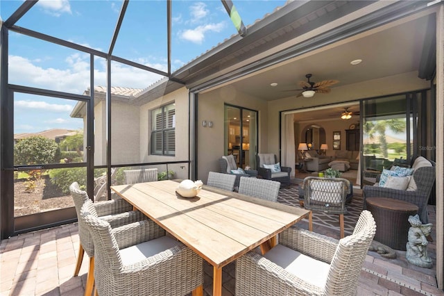 sunroom with ceiling fan