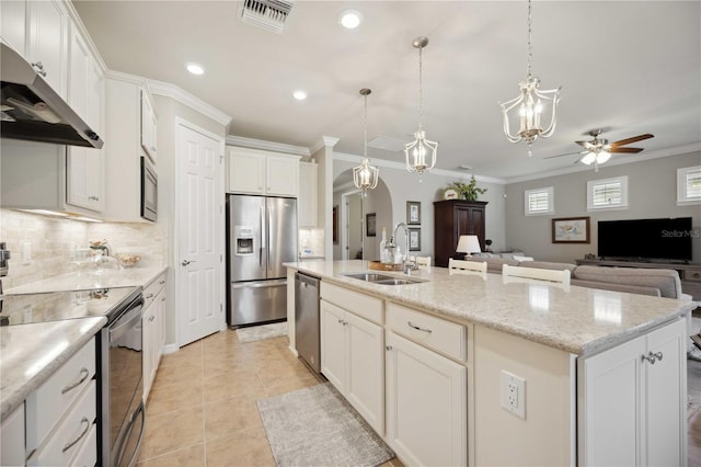 13510 Esposito St, Venice, FL 34293 - kitchen featuring stainless steel appliances, ventilation hood, a ceiling fan, open floor plan, and an island with sink