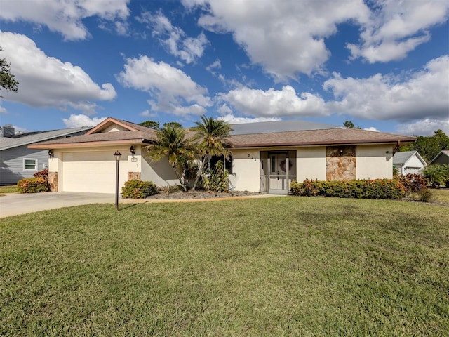 single story home featuring a garage and a front lawn