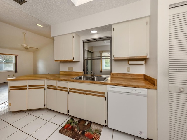 kitchen featuring dishwasher, white cabinets, sink, ceiling fan, and a textured ceiling