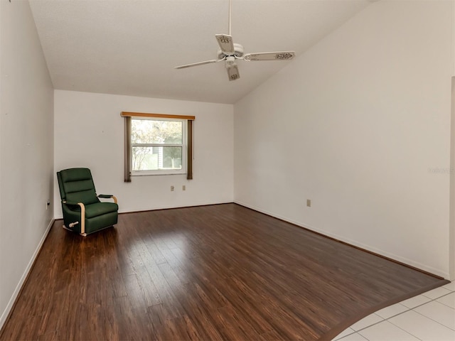 unfurnished room with hardwood / wood-style flooring, ceiling fan, and lofted ceiling