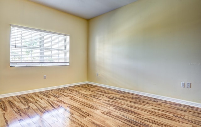 unfurnished room featuring light wood-type flooring