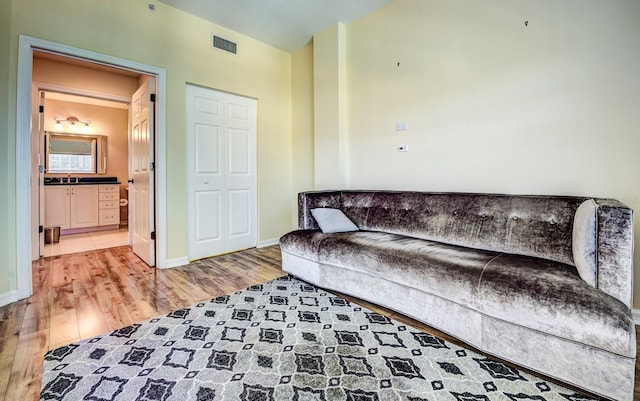 living room featuring sink and hardwood / wood-style flooring