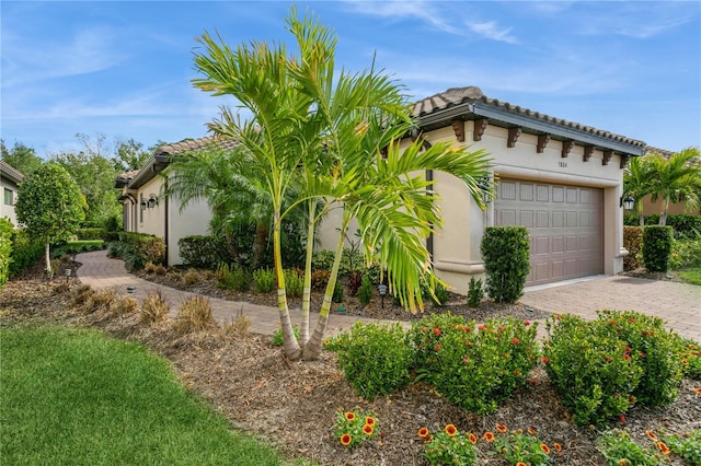 view of side of home with a garage