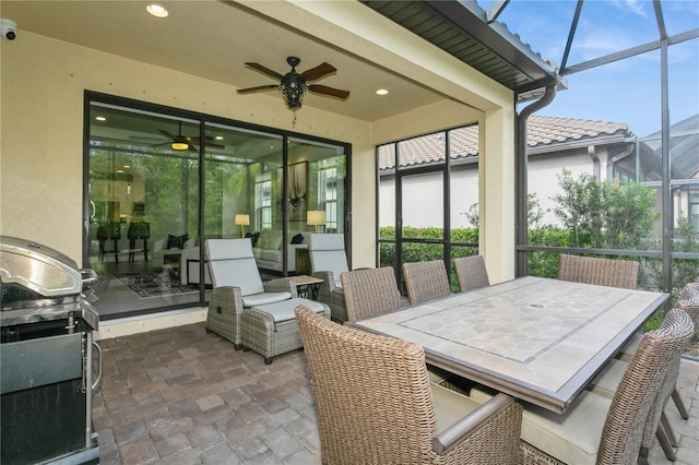 view of patio featuring ceiling fan and a grill