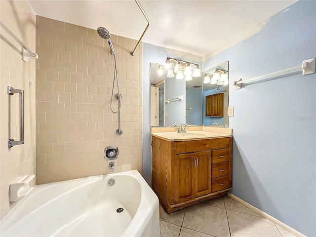 bathroom featuring tiled shower / bath, vanity, and tile patterned floors