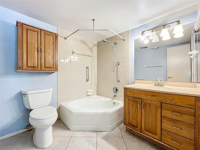 full bathroom with tiled shower / bath, vanity, toilet, and tile patterned flooring