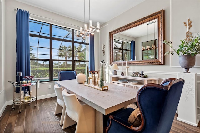 dining space with an inviting chandelier