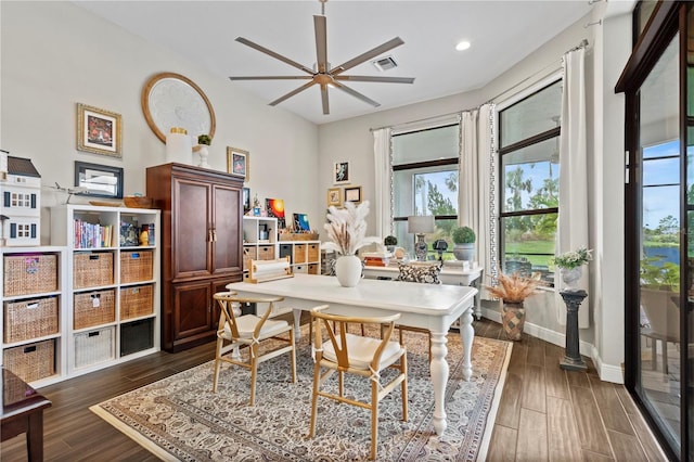 dining space with a wealth of natural light and ceiling fan