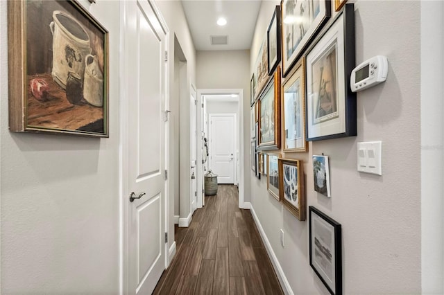 corridor with dark wood-type flooring