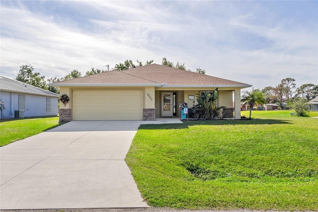 ranch-style home with central air condition unit, a front yard, and a garage