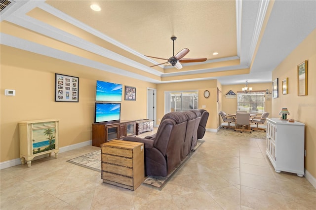 tiled living room featuring a textured ceiling, ceiling fan with notable chandelier, a tray ceiling, and crown molding