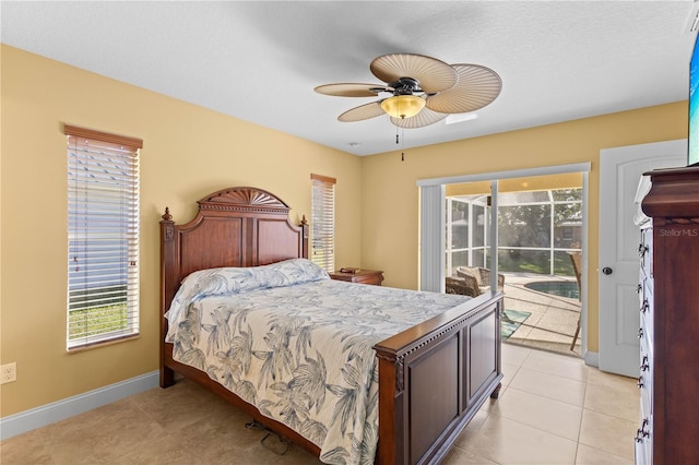 tiled bedroom featuring access to outside and ceiling fan