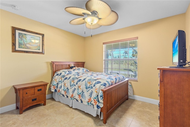 bedroom with ceiling fan and light tile patterned floors