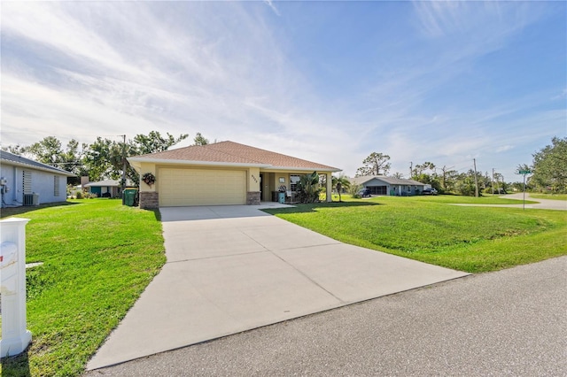 view of front of property featuring a front lawn and a garage