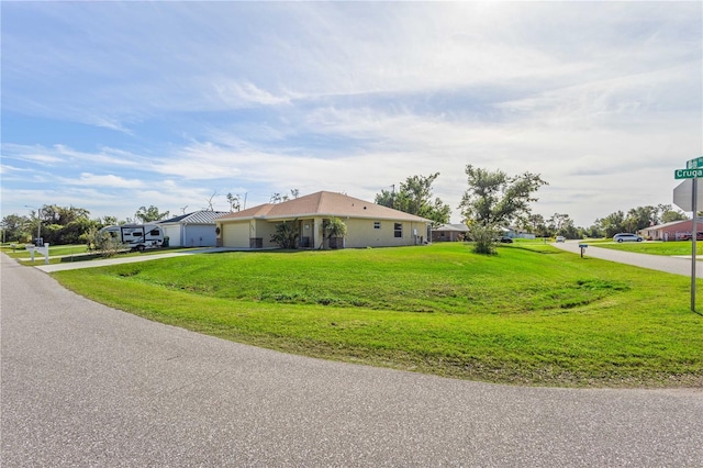 view of side of property with a lawn