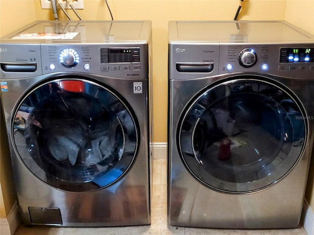 washroom featuring washing machine and dryer