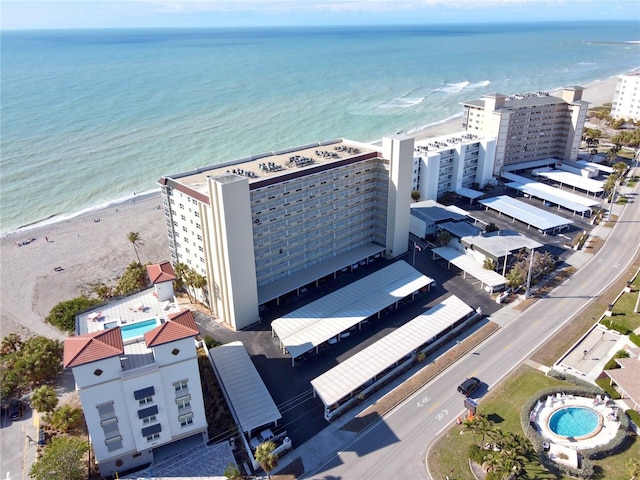 aerial view featuring a water view and a beach view