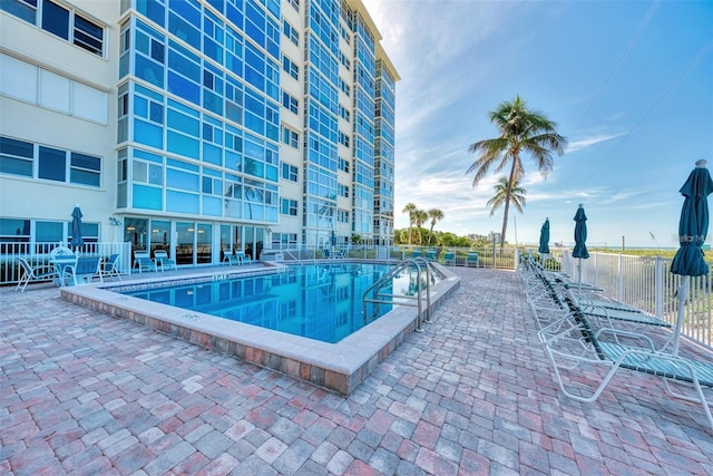 view of pool featuring a patio area