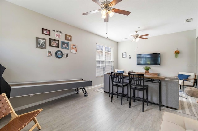 interior space featuring light hardwood / wood-style floors and ceiling fan