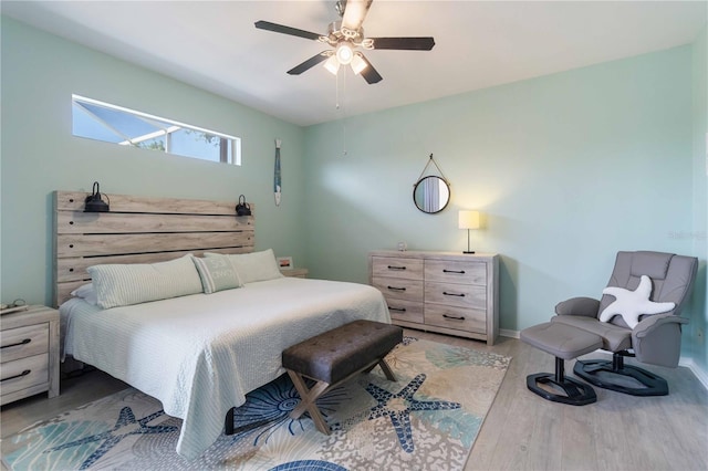 bedroom with wood-type flooring and ceiling fan