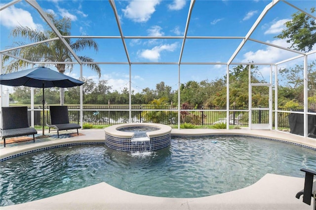 view of swimming pool with glass enclosure, a patio area, a water view, and an in ground hot tub