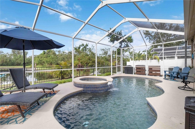 view of swimming pool with an in ground hot tub, pool water feature, glass enclosure, and a patio area