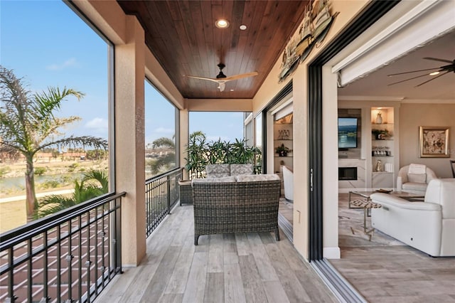 balcony featuring ceiling fan