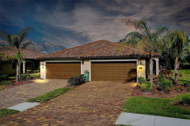 mediterranean / spanish house with a garage