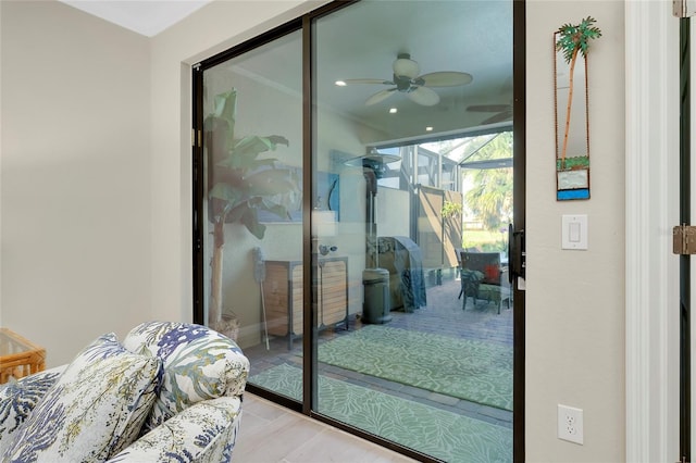 doorway with ceiling fan