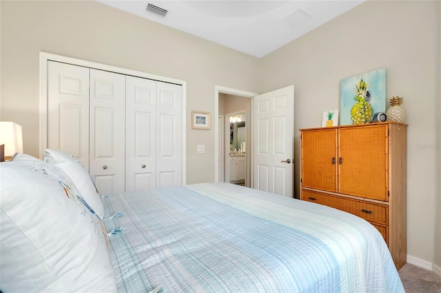 carpeted bedroom with a closet