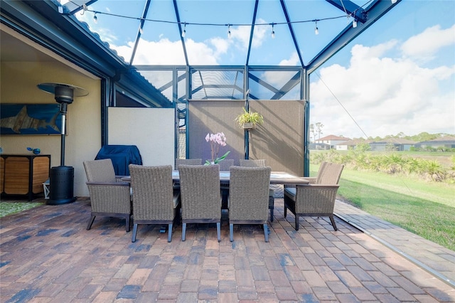 view of patio / terrace featuring glass enclosure