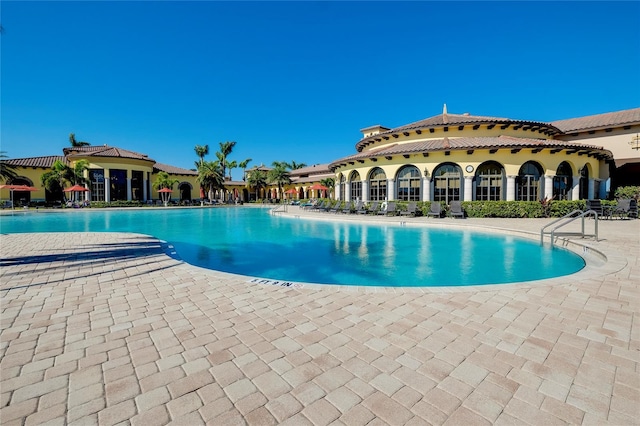 view of swimming pool featuring a patio area