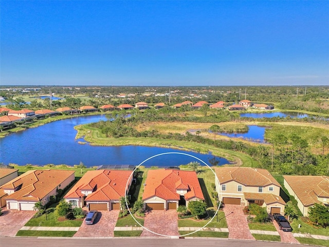 birds eye view of property featuring a water view