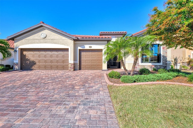 mediterranean / spanish-style home with a garage