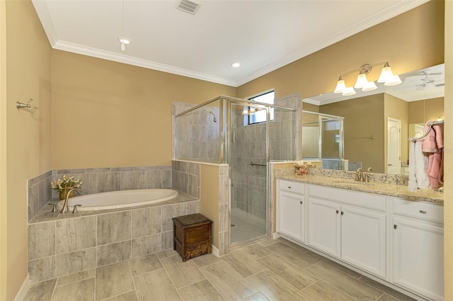 bathroom featuring separate shower and tub, crown molding, and vanity