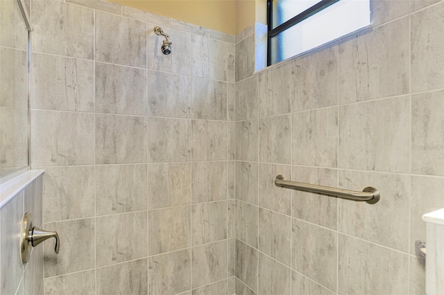 bathroom with tiled shower