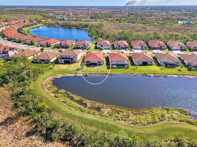 drone / aerial view with a water view