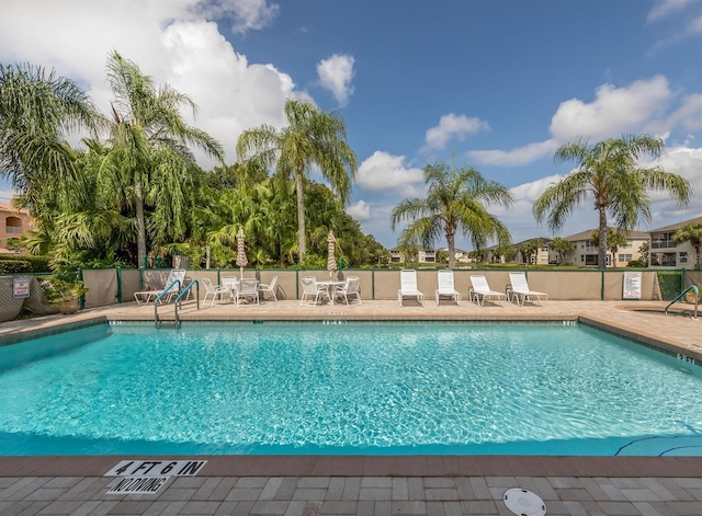 view of swimming pool with a patio