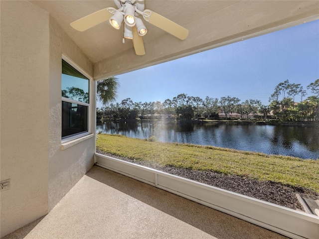 exterior space featuring a water view and ceiling fan